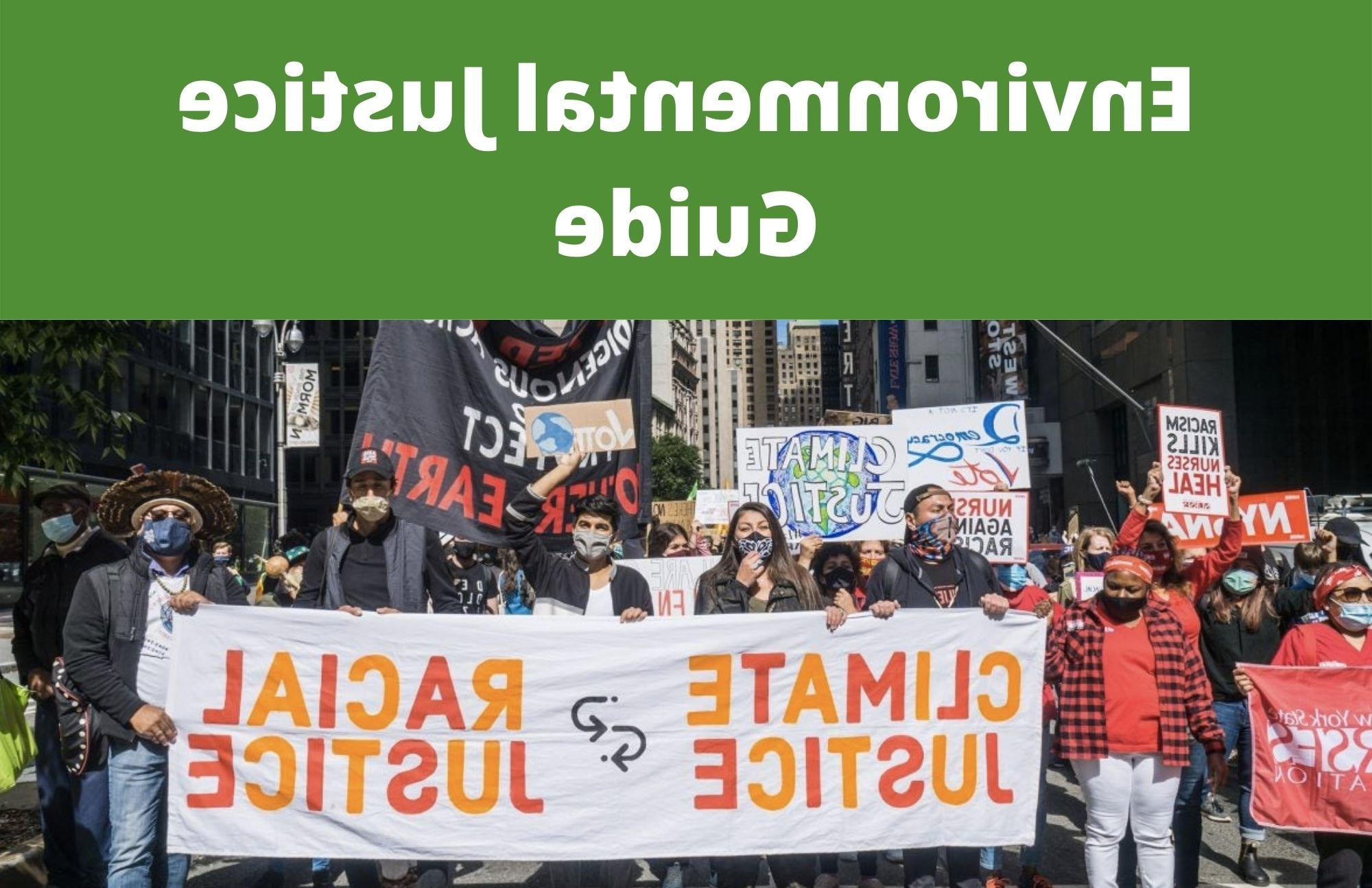 Picture of Extinction Rebellion in city with group of people holding banner 